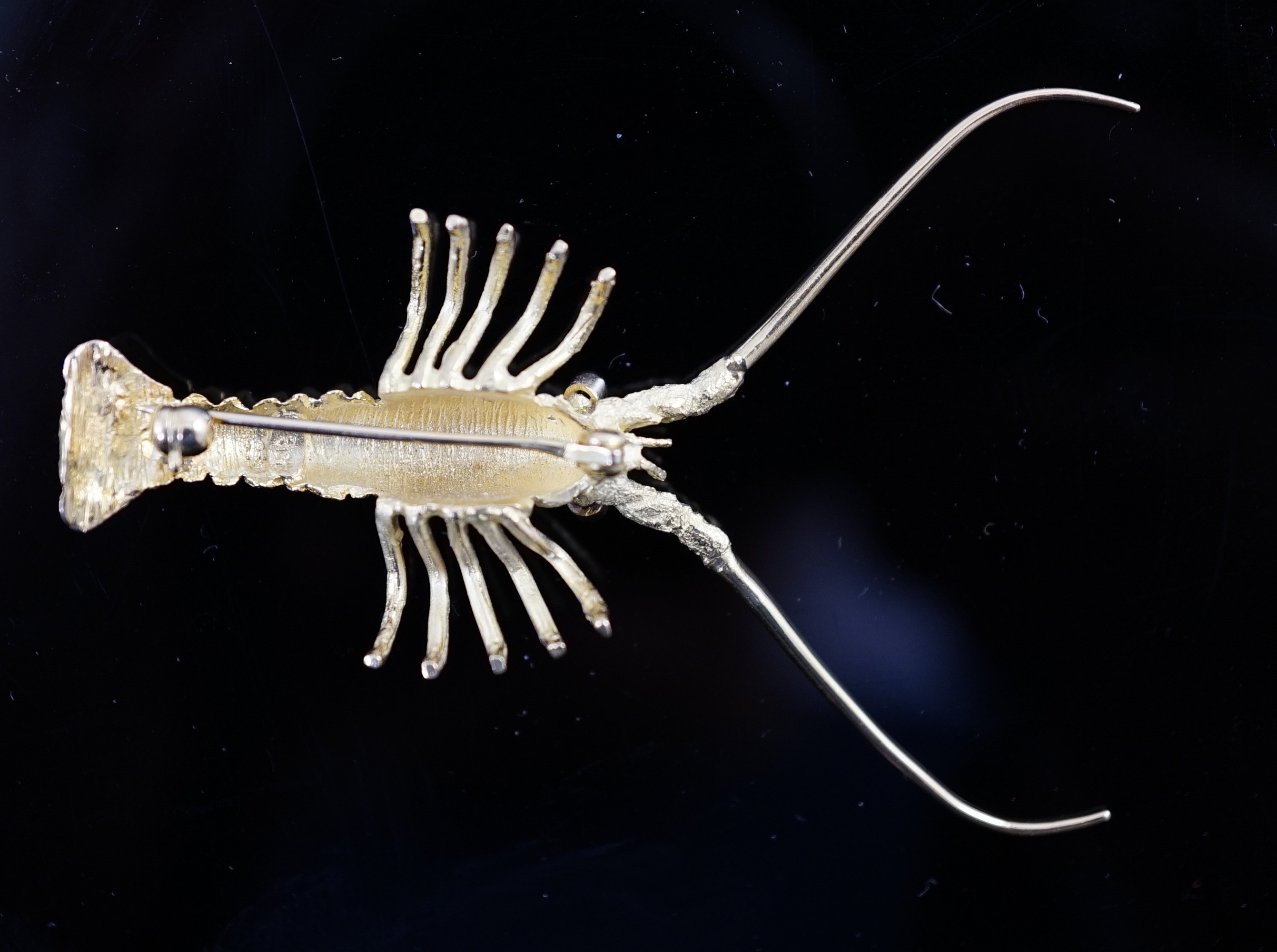 An Astwood Dickinson 18ct gold lobster brooch